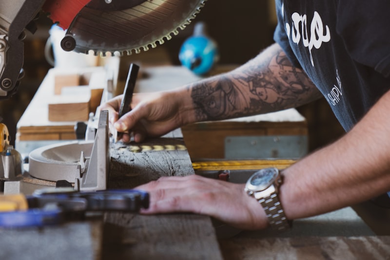 A circular saw cutting through a plank of wood.